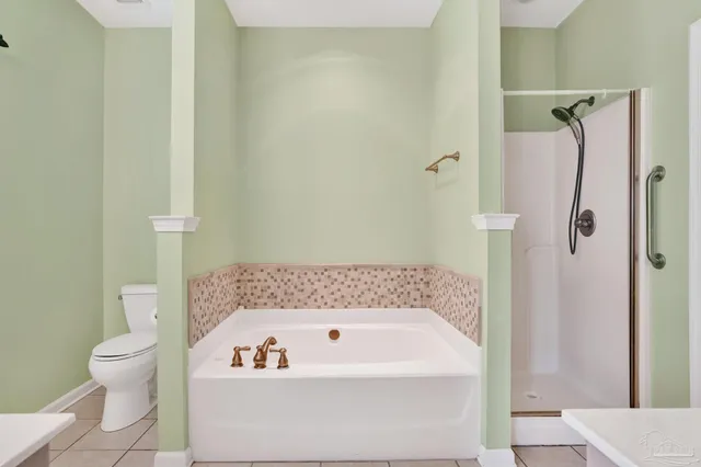 a bathroom with a bathtub and toilet