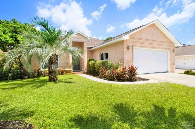 a front view of house with yard and seating area