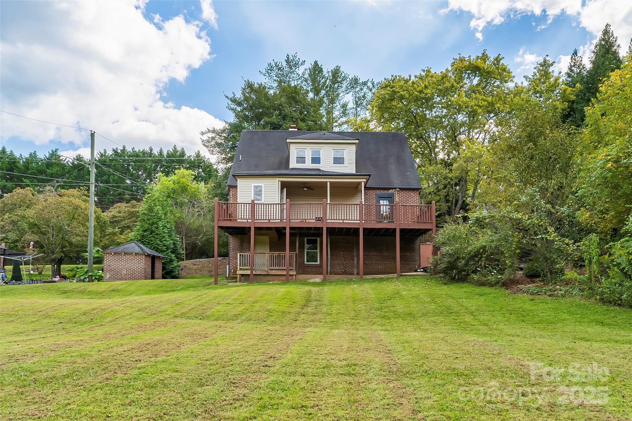 1205 East Union Street Morganton, NC 28655 - Photo 31 of 35 a view of a house with a yard and sitting area