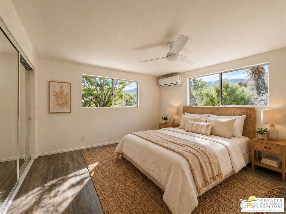 49760 Big Morongo Canyon Road Morongo Valley, CA 92256 - Photo 22 of 47 a bedroom with a bed and a large window