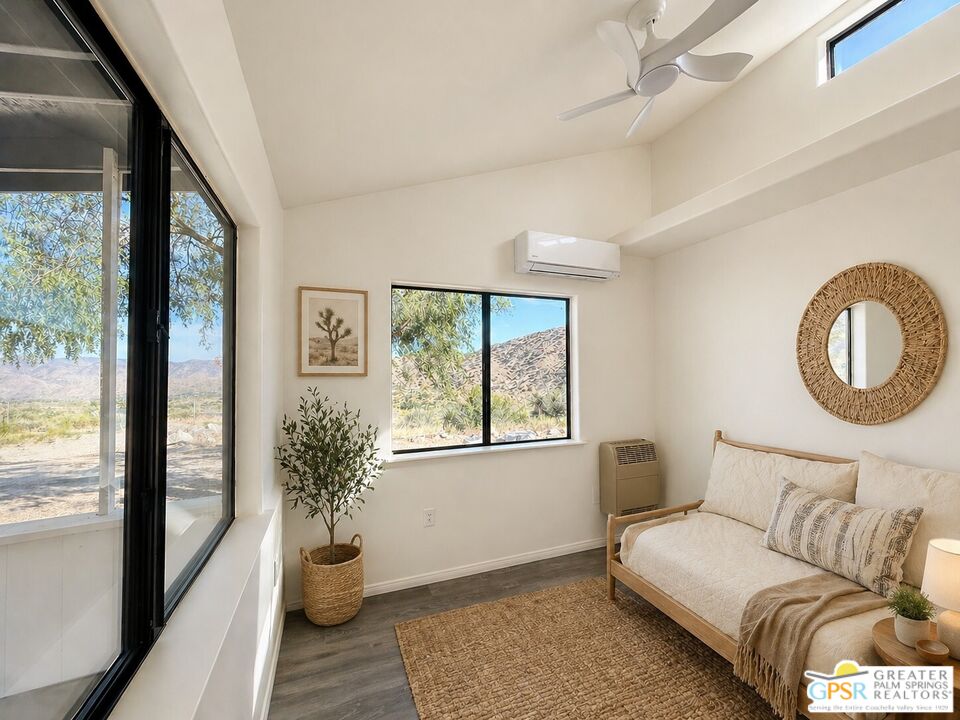 49760 Big Morongo Canyon Road Morongo Valley, CA 92256 - Photo 25 of 47 a living room with furniture and a window