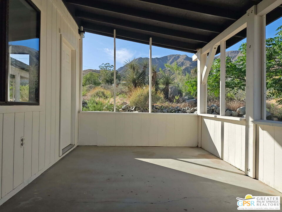 49760 Big Morongo Canyon Road Morongo Valley, CA 92256 - Photo 26 of 47 a view of a building from a porch