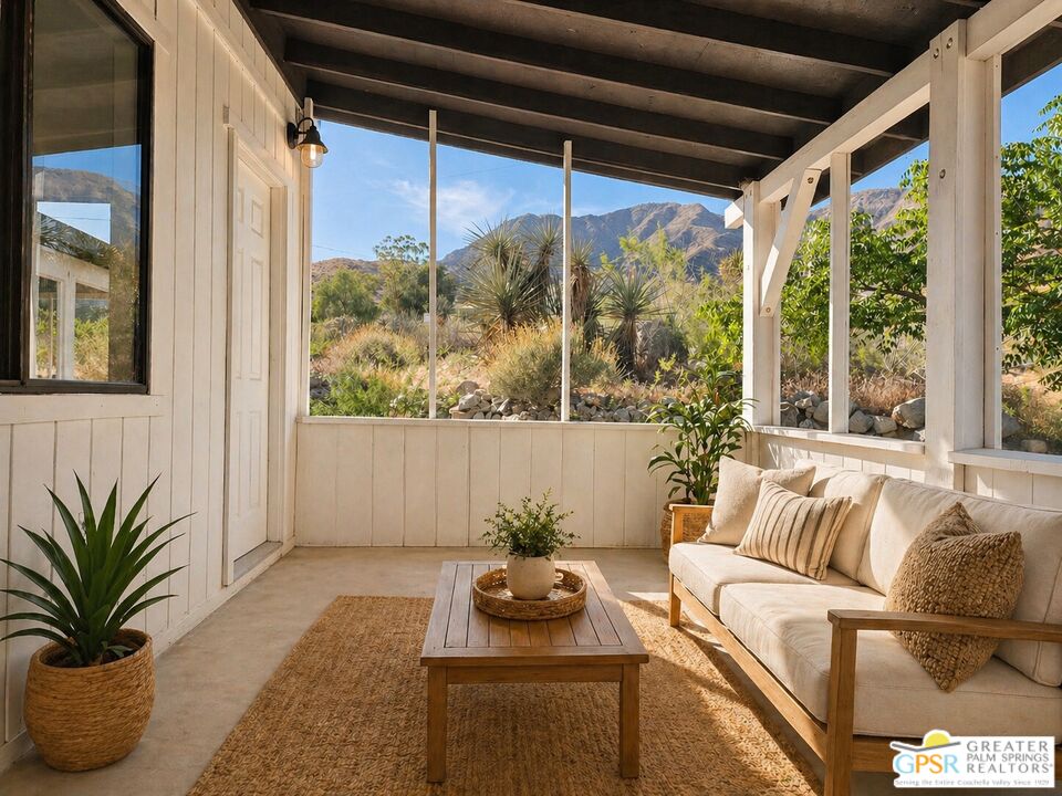 49760 Big Morongo Canyon Road Morongo Valley, CA 92256 - Photo 27 of 47 a living room with furniture and a potted plant