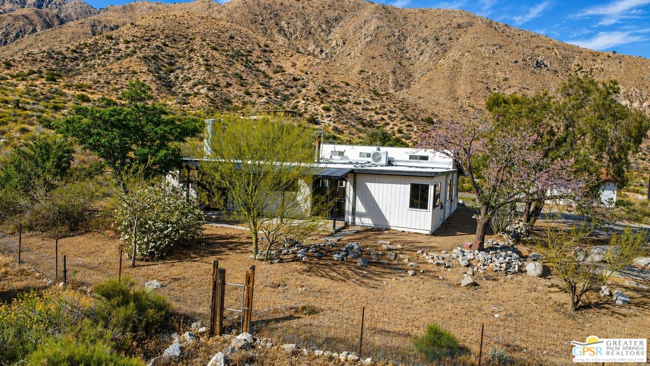 49760 Big Morongo Canyon Road Morongo Valley, CA 92256 - Photo 36 of 47 a view of a house with a yard