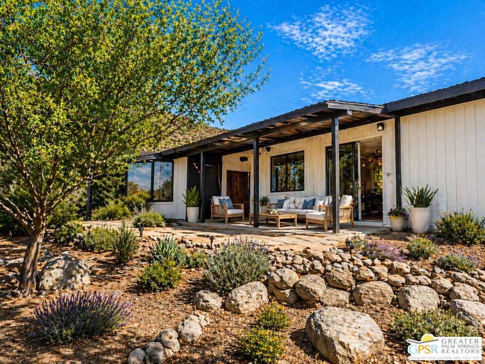 49760 Big Morongo Canyon Road Morongo Valley, CA 92256 - Photo 39 of 47 a front view of a house with garden