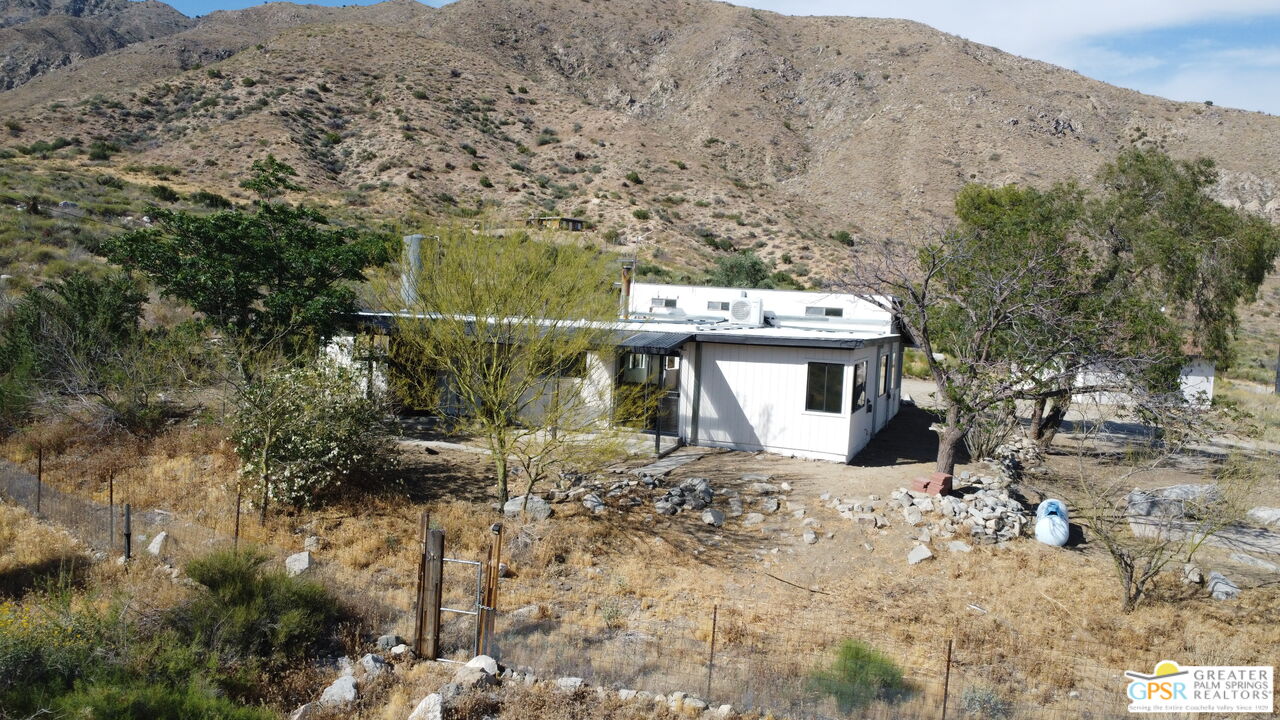 49760 Big Morongo Canyon Road Morongo Valley, CA 92256 - Photo 45 of 47 a view of a house with a yard