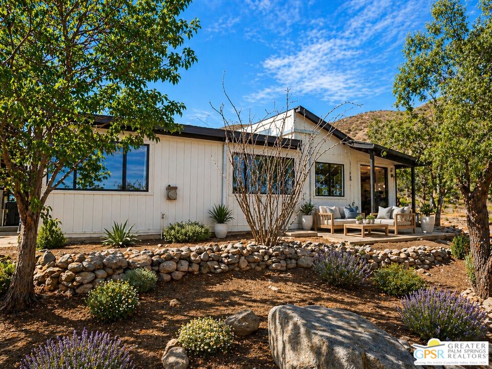 49760 Big Morongo Canyon Road Morongo Valley, CA 92256 - Photo 46 of 47 a front view of a house with garden