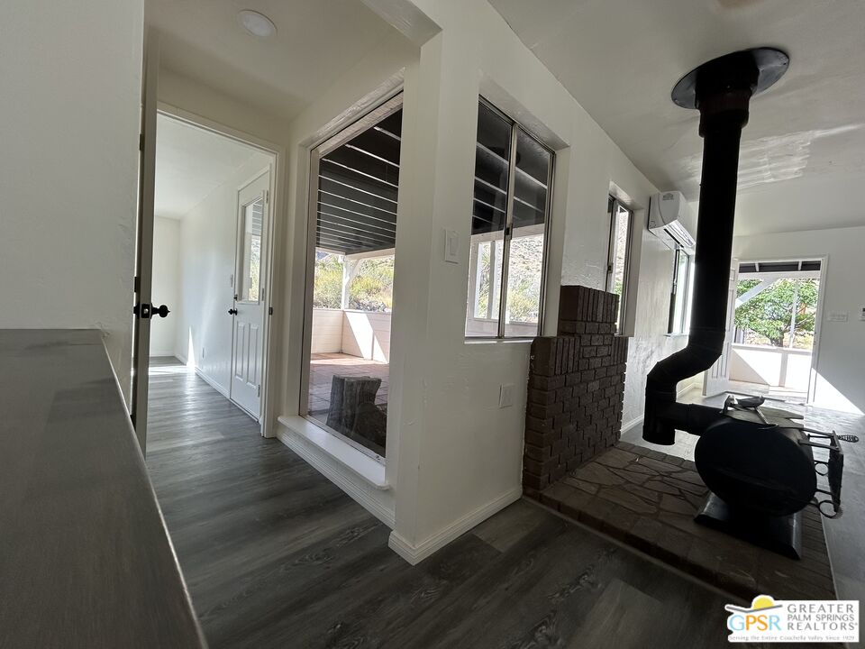 49760 Big Morongo Canyon Road Morongo Valley, CA 92256 - Photo 5 of 47 a view of hallway with furniture and a window