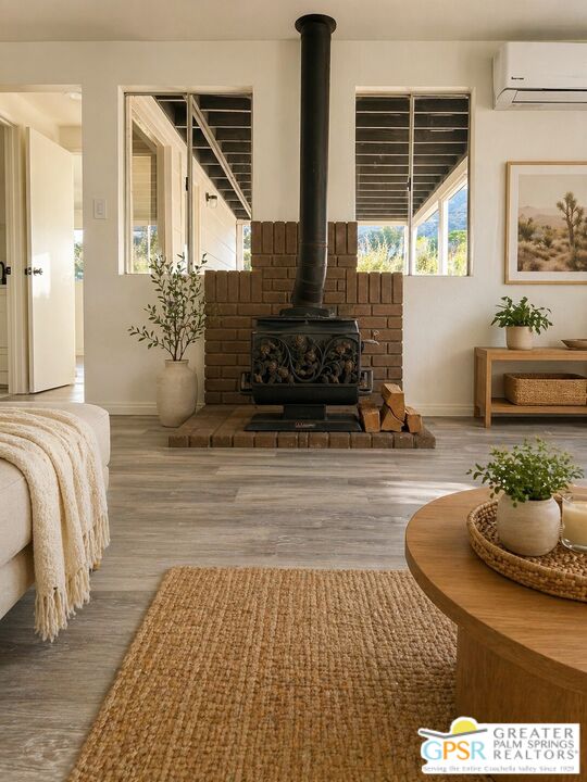 49760 Big Morongo Canyon Road Morongo Valley, CA 92256 - Photo 6 of 47 a spacious bedroom with a balcony a bed and a couch
