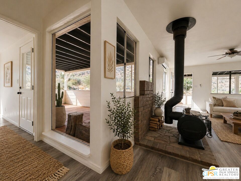 49760 Big Morongo Canyon Road Morongo Valley, CA 92256 - Photo 7 of 47 a living room with furniture and a fireplace