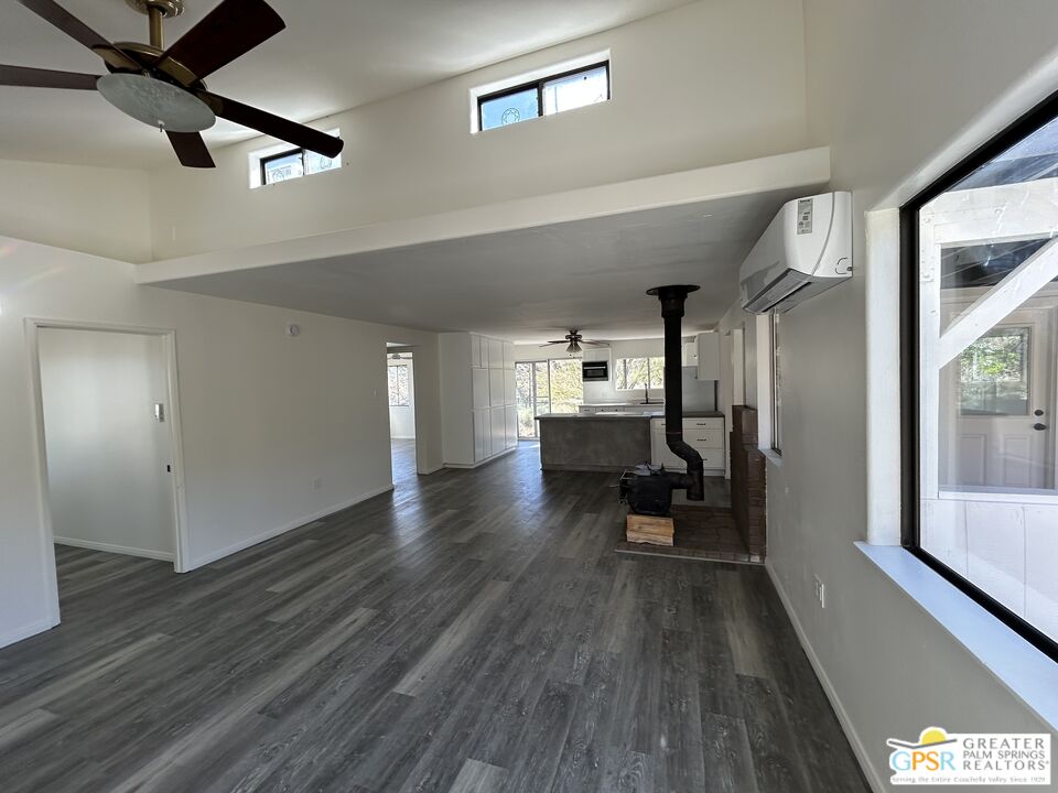 49760 Big Morongo Canyon Road Morongo Valley, CA 92256 - Photo 8 of 47 a view of a living room a dining room wooden floor and a window