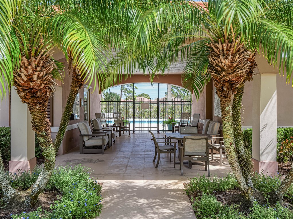 5824 Pine Ridge Circle Vero Beach, FL 32967 - Photo 33 of 34 a view of a sitting area with furniture and garden