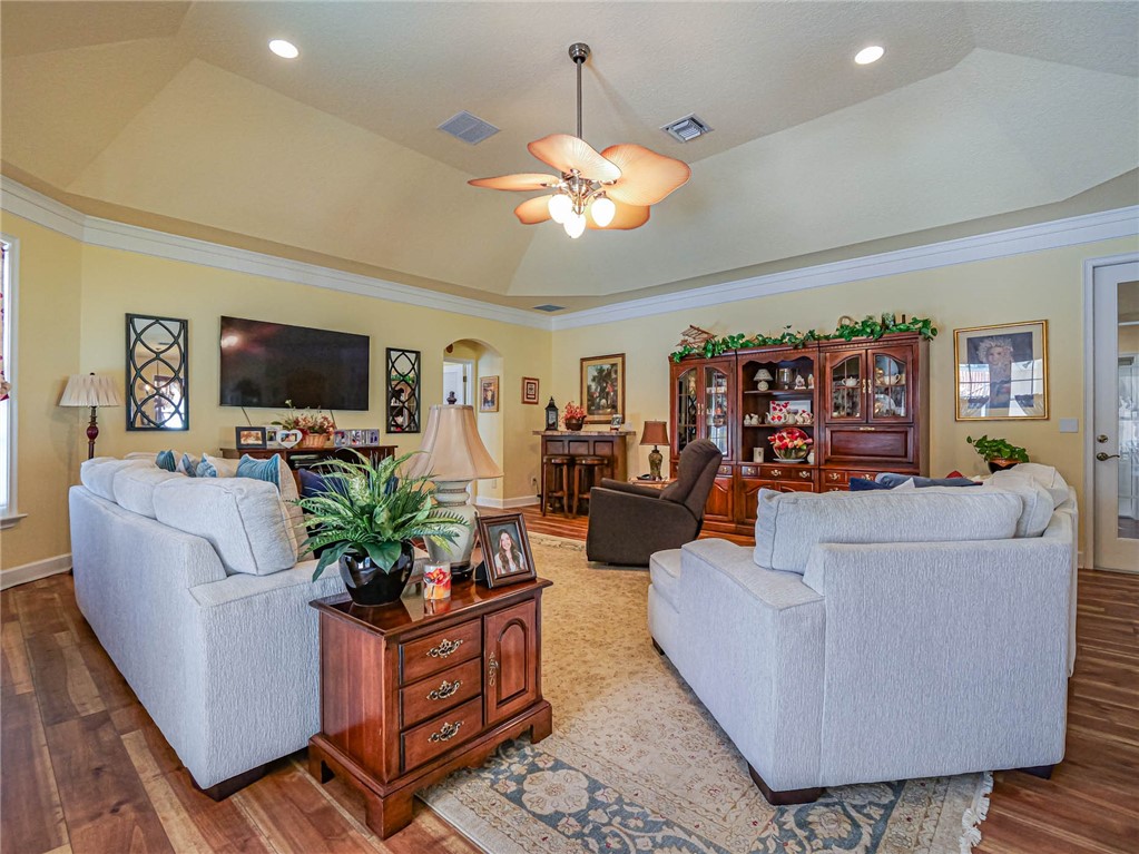 5824 Pine Ridge Circle Vero Beach, FL 32967 - Photo 4 of 34 a living room with furniture and a flat screen tv