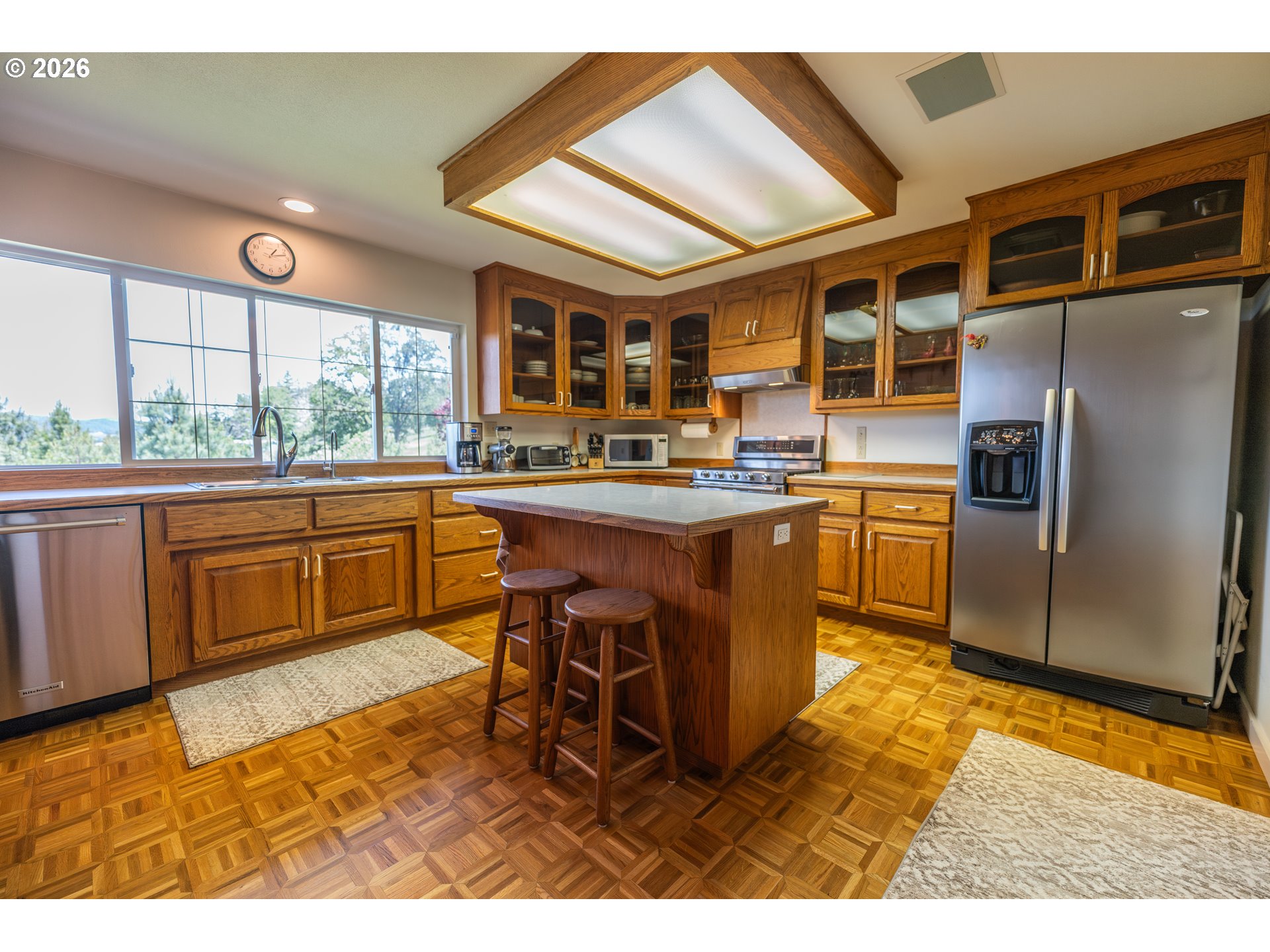 489 Fir Vista Road Sutherlin, OR 97479 - Photo 8 of 47 a kitchen with stainless steel appliances granite countertop a sink and a refrigerator