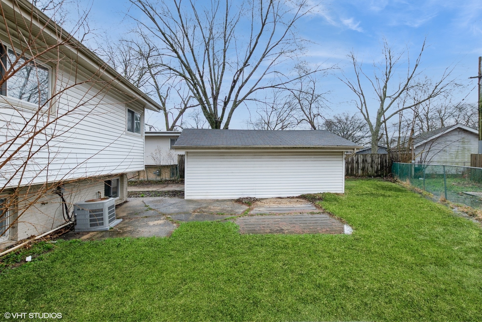 363 Winnebago Street Park Forest, IL 60466 - Photo 14 of 14 a view of backyard of house with outdoor seating and green space