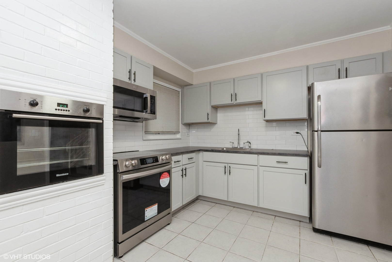 363 Winnebago Street Park Forest, IL 60466 - Photo 4 of 14 a kitchen with cabinets and stainless steel appliances