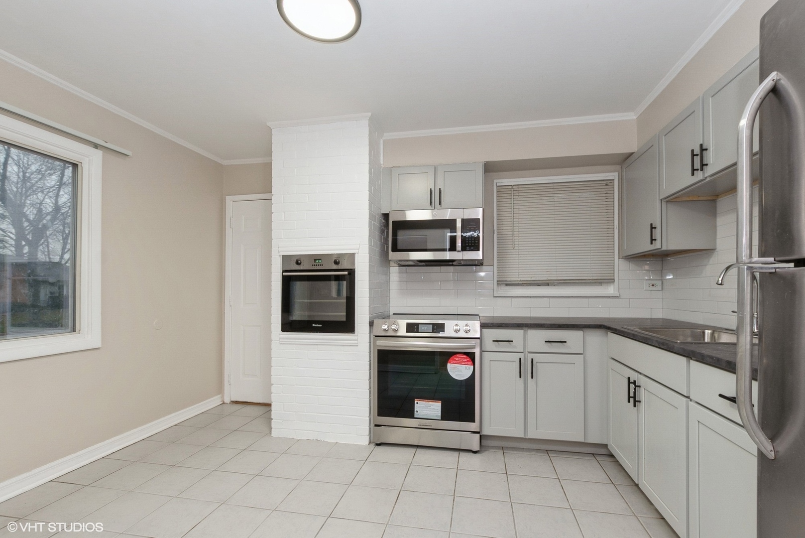 363 Winnebago Street Park Forest, IL 60466 - Photo 5 of 14 a kitchen with stainless steel appliances granite countertop a refrigerator sink and stove