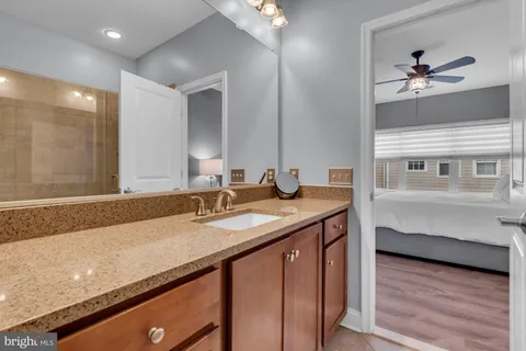a bathroom with a shower and a sink