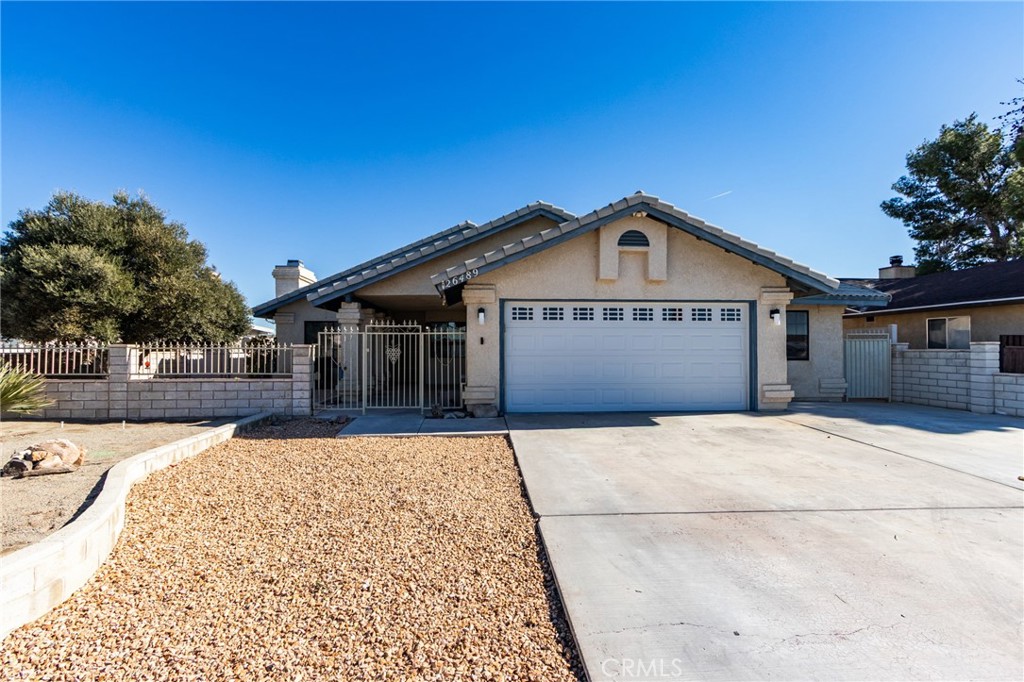 26489 Bluewater Road Helendale, CA 92342 - Photo 1 of 62 a front view of a house with a yard