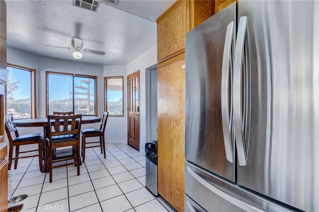 26489 Bluewater Road Helendale, CA 92342 - Photo 14 of 62 a view of a dining room with furniture and a window