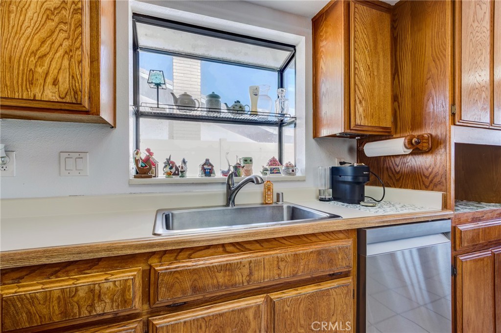 26489 Bluewater Road Helendale, CA 92342 - Photo 15 of 62 a kitchen with stainless steel appliances granite countertop a sink a stove and cabinets