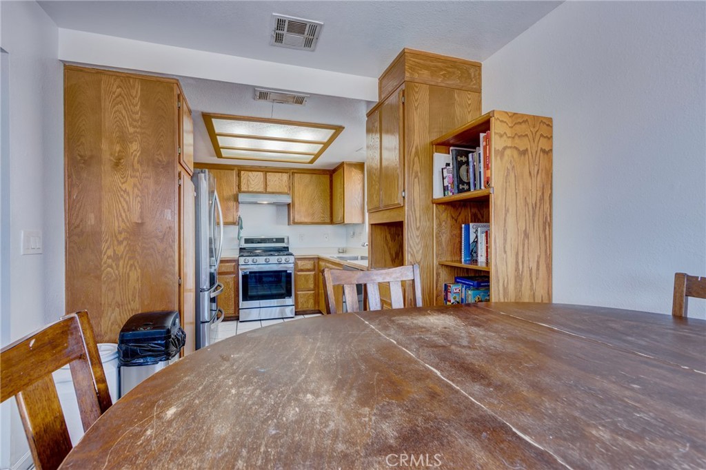 26489 Bluewater Road Helendale, CA 92342 - Photo 16 of 62 a bed room with a bed and a chair