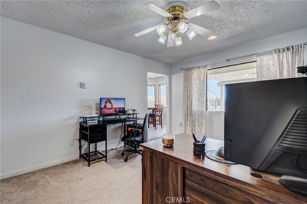 26489 Bluewater Road Helendale, CA 92342 - Photo 19 of 62 a workspace with furniture and window
