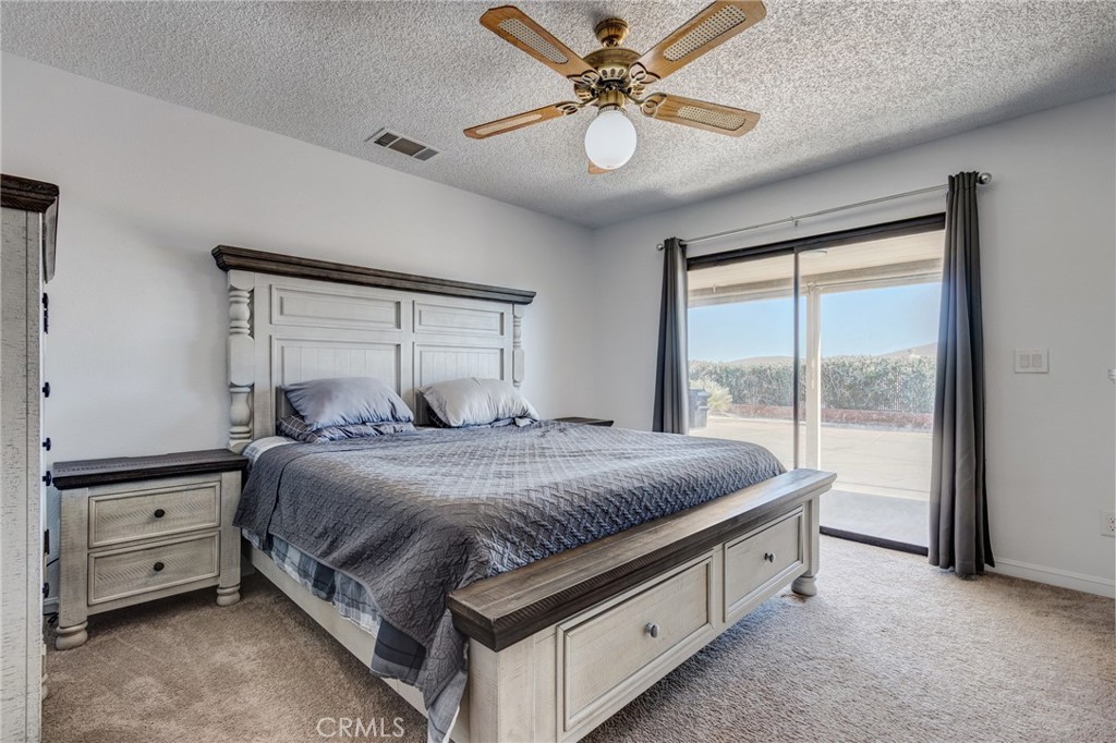 26489 Bluewater Road Helendale, CA 92342 - Photo 23 of 62 a bedroom with a bed and a window