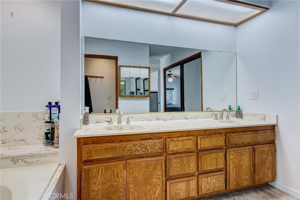 26489 Bluewater Road Helendale, CA 92342 - Photo 28 of 62 a bathroom with a sink and a mirror