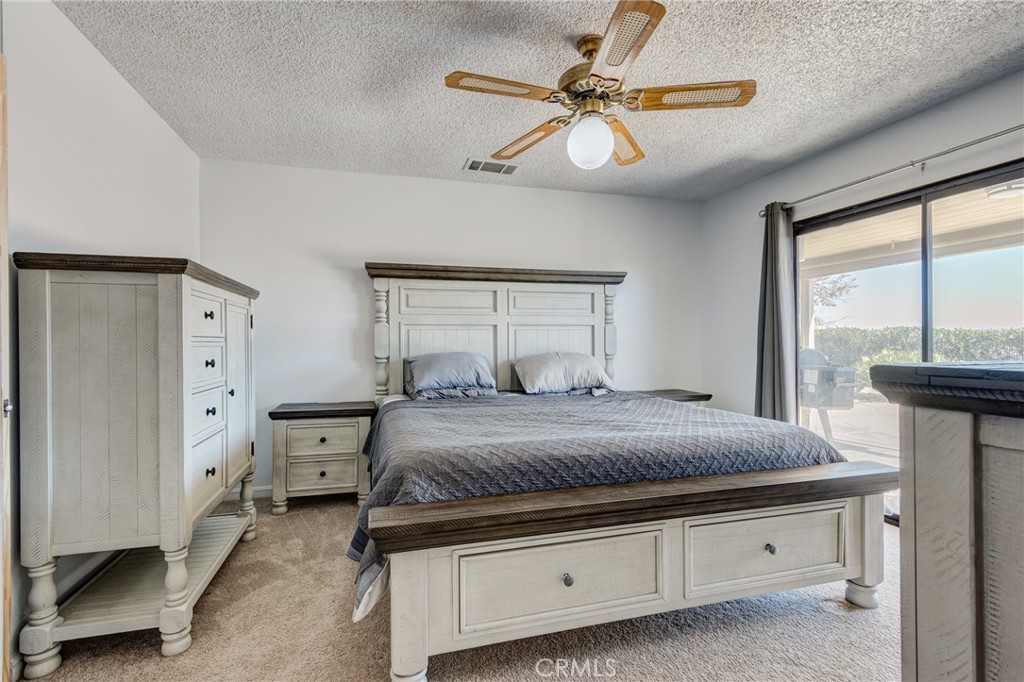 26489 Bluewater Road Helendale, CA 92342 - Photo 30 of 62 a bedroom with a bed and a window