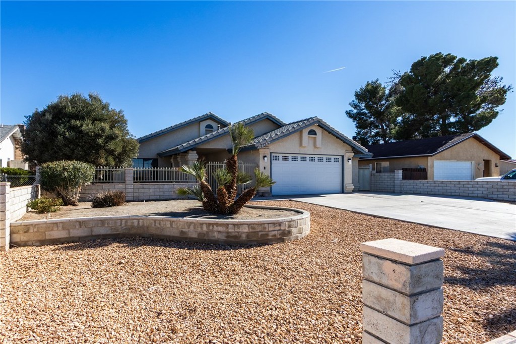26489 Bluewater Road Helendale, CA 92342 - Photo 3 of 62 a front view of a house with a yard