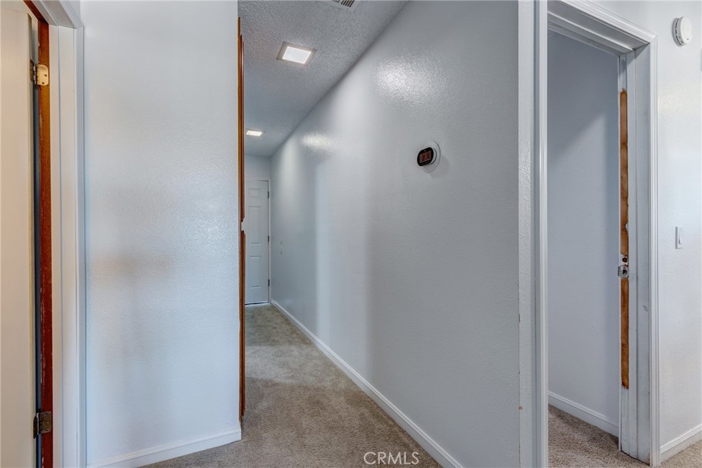 26489 Bluewater Road Helendale, CA 92342 - Photo 31 of 62 a view of a hallway