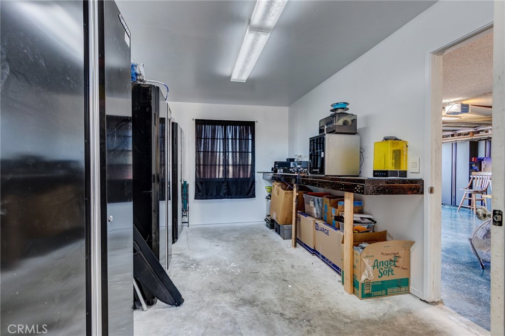 26489 Bluewater Road Helendale, CA 92342 - Photo 33 of 62 a view of a hallway with workspace and window