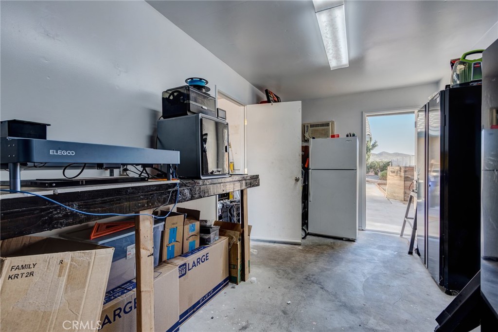 26489 Bluewater Road Helendale, CA 92342 - Photo 34 of 62 a kitchen with stainless steel appliances granite countertop a refrigerator and a stove