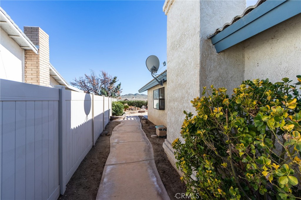 26489 Bluewater Road Helendale, CA 92342 - Photo 40 of 62 a narrow alley leading to a building