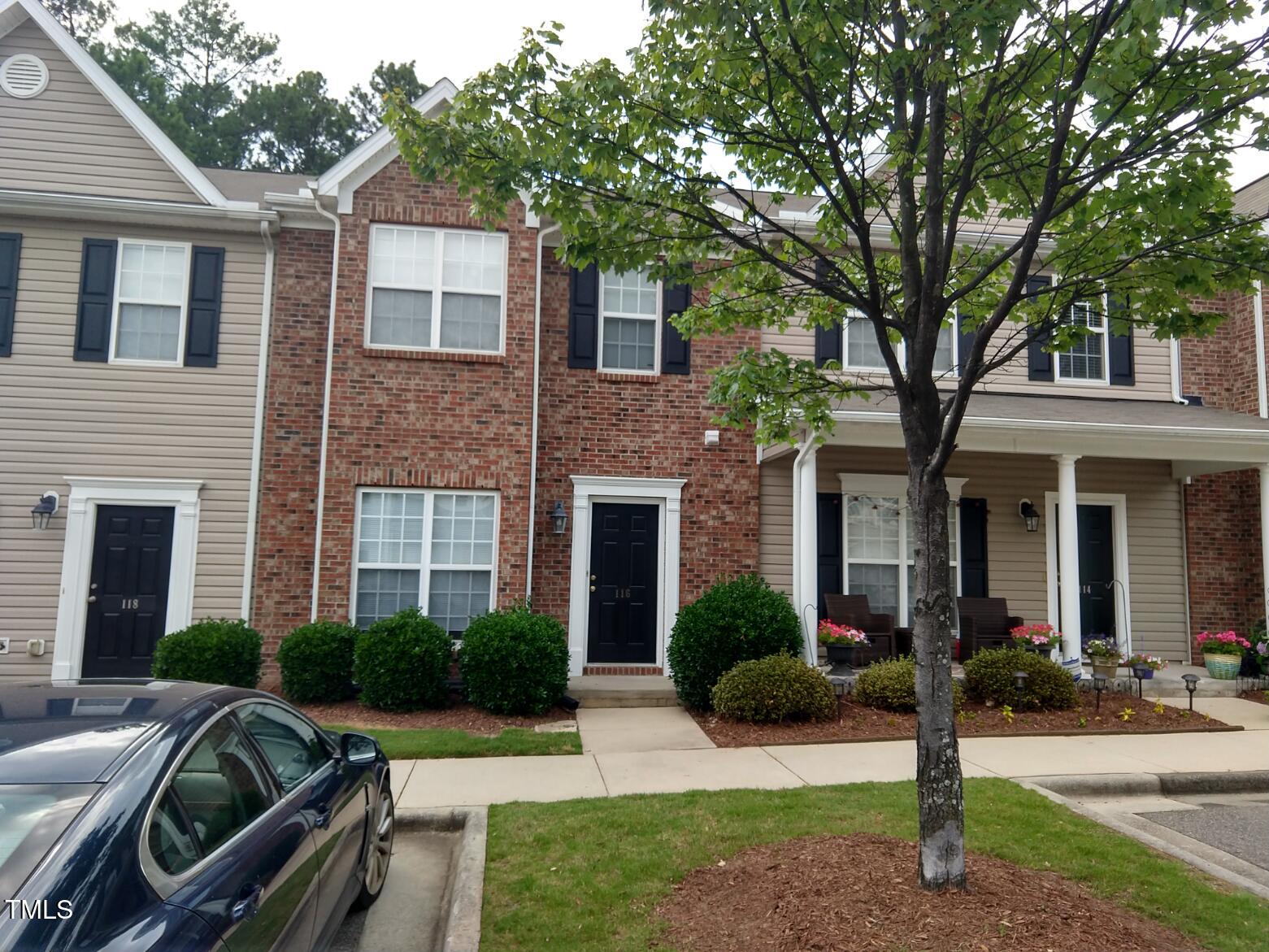 a view of a house with backyard and porch