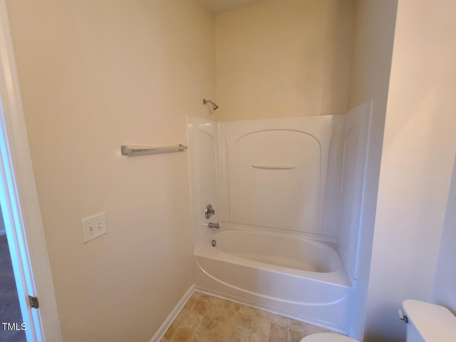 116 Hidden Springs Drive Durham, NC 27703 - Photo 14 of 19 a bathroom with a bathtub
