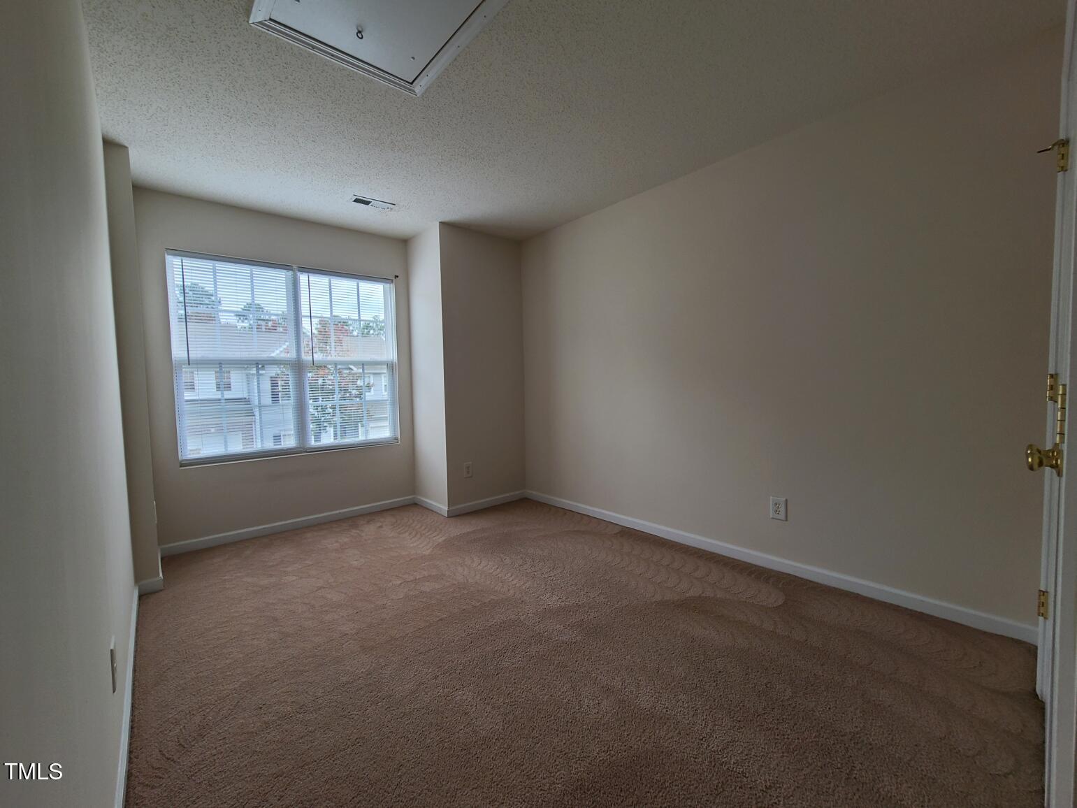 116 Hidden Springs Drive Durham, NC 27703 - Photo 15 of 19 an empty room with windows
