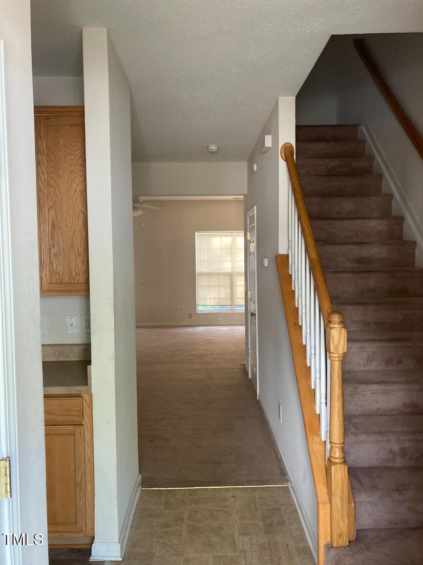116 Hidden Springs Drive Durham, NC 27703 - Photo 3 of 19 a view of entryway and hall with wooden floor