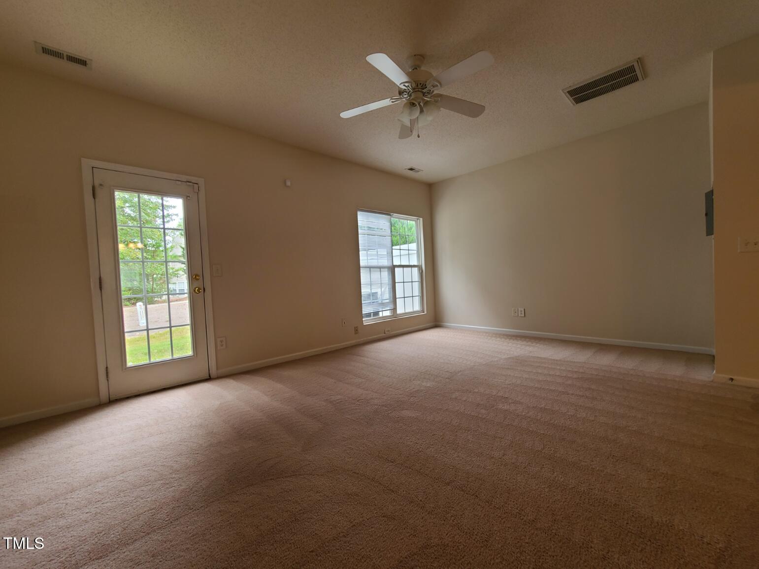 116 Hidden Springs Drive Durham, NC 27703 - Photo 7 of 19 an empty room with a window