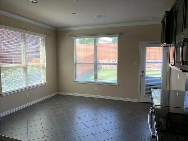 a view of livingroom with workspace and a window