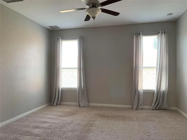 an empty room that has a window