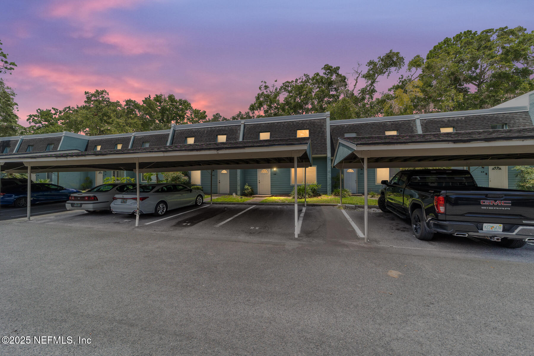 a view of house with outdoor space and car parked