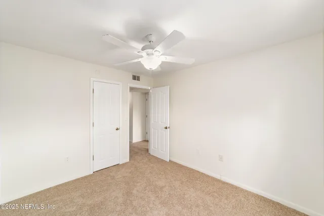 a view of parking garage with a car parked