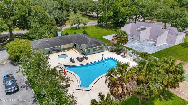 an aerial view of a house with a garden