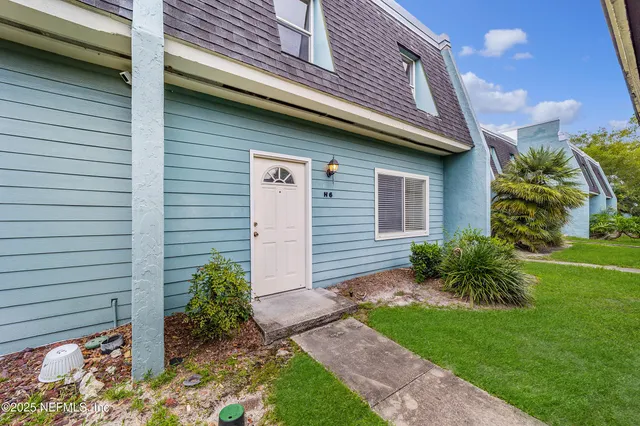 a yellow house with outdoor space