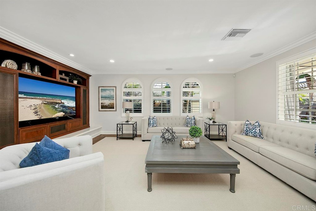 3220 Sitio Montecillo Carlsbad, CA 92009 - Photo 12 of 48 a living room with furniture and a flat screen tv