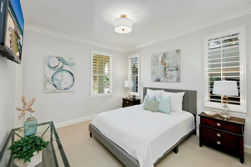 3220 Sitio Montecillo Carlsbad, CA 92009 - Photo 15 of 48 a bedroom with a large bed and a window