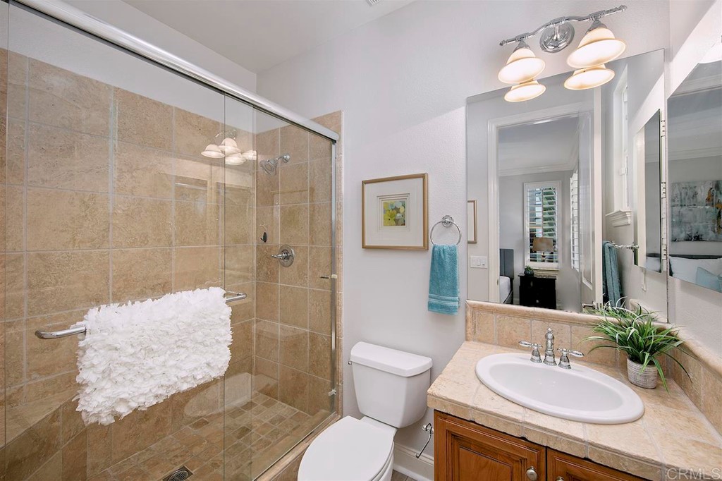 3220 Sitio Montecillo Carlsbad, CA 92009 - Photo 17 of 48 a bathroom with a sink toilet and shower