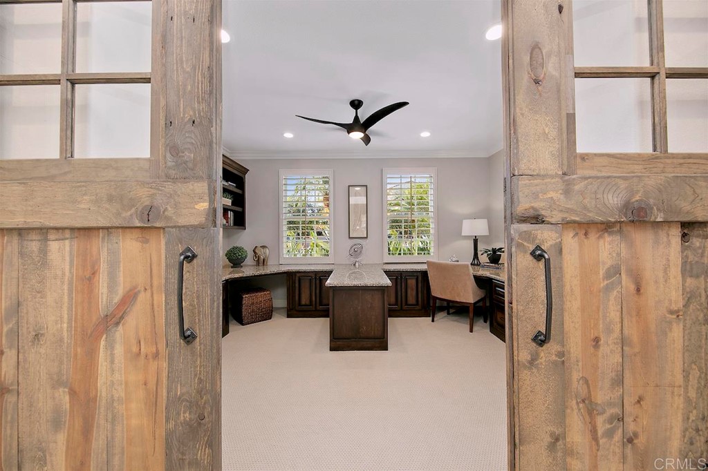 3220 Sitio Montecillo Carlsbad, CA 92009 - Photo 19 of 48 a living room with furniture a window and a ceiling fan